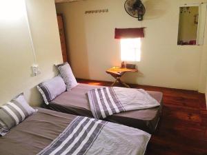 Postel nebo postele na pokoji v ubytování Bao Loc Homestay