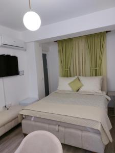 מיטה או מיטות בחדר ב-JAGODINA apartman
