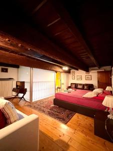 a bedroom with a large bed and a couch at Saint Patrick-Guest House Del 1200 in Barletta +134 photos