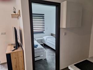 Posteľ alebo postele v izbe v ubytovaní MB APARTMÁNY LIPNO