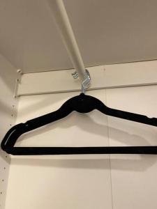 a black object is hanging from a ceiling at Möblierte Wohnung Hannover List in Hannover