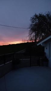 a view of a sunset from a balcony of a house at Los Sauces de la Fuente in Santillana del Mar