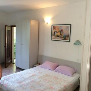 Llit o llits en una habitació de Apartment Kordić