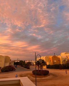 a cloudy sky over a street in a city at Makady heights in Hurghada