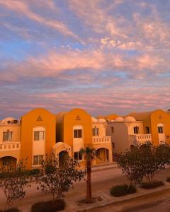 a group of buildings with a sky in the background at Makady heights in Hurghada