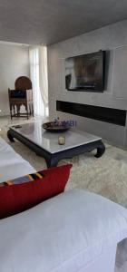a living room with a coffee table and a couch at Tangier Mediterranean Villa in Tangier