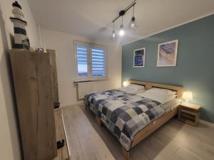 Katil atau katil-katil dalam bilik di Apartament Nad Klifem SEA VIEW