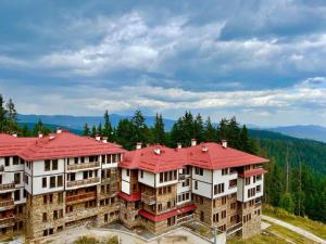 an aerial view of a building with a red roof at Avelov Art Studio in Pamporovo