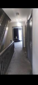 an empty hallway with a staircase in a building at Royal house in Ilkeston