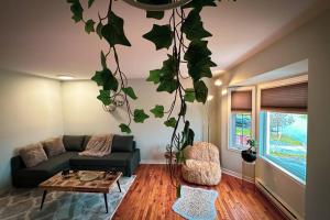 a living room with a couch and a table at Entire house 3 min Drive to beach in Eastern Passage