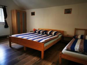 a bedroom with two beds in a room at Drevenica Spanka in Špania Dolina