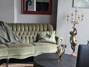 a living room with a couch and a table at Ferienhaus MaLu Zell in Zell an der Mosel