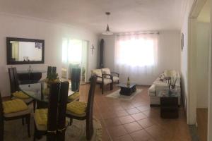 a living room with a couch and a table at Casa em Teresopolis in Teresópolis