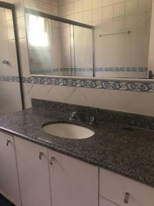 a bathroom counter with a sink and a mirror at Casa em Teresopolis in Teresópolis +35 photos