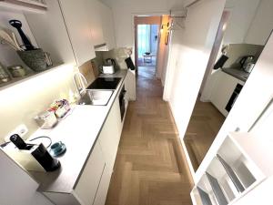 an overhead view of a kitchen with white counters at Boutique Apartment in Vienna