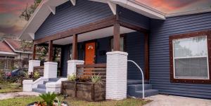 a blue house with a front porch and a orange door at Luxury 5-BR House, Tampa Downtown with Cottage in Tampa