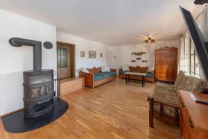 a living room with a wood stove in it at Holiday Home Kersnik in Bohinj