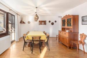 a dining room with a table and chairs at Holiday Home Kersnik in Bohinj