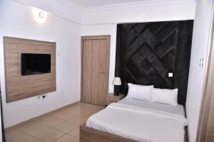 Giường trong phòng chung tại 1118 Serenity Residence