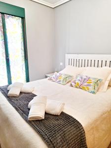 Tempat tidur dalam kamar di APARTAMENTO TURISTICO EL CANALIZO