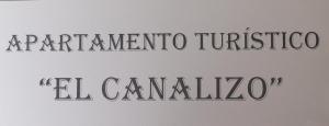 APARTAMENTO TURISTICO EL CANALIZO في كانديلاريو: علامة مع كلمات الجهاز tactomino tucsonociali cantina