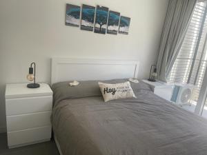 a bedroom with a bed with a pillow on it at Soleado in Buenos Aires