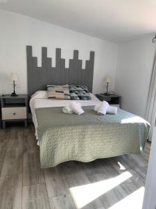 A bed or beds in a room at Atico Casa Mari