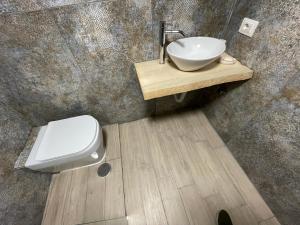 a bathroom with a sink and a toilet at Lo Studio della Riviera in Naples