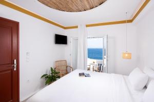 Posteľ alebo postele v izbe v ubytovaní Hotel Tagoo