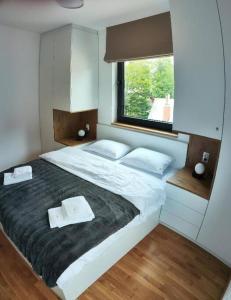 A bed or beds in a room at Maxx Apartmani Obucina Kapije
