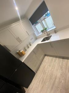 an overhead view of a kitchen with a sink at Erin Guest House in Bristol