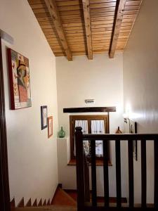 a room with a staircase with a wooden ceiling at Casa Rural Juanbarterena in Ulzurrun