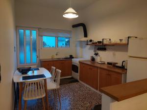 A kitchen or kitchenette at MG elounda apt