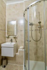 a bathroom with a sink and a shower at Parkview in Dunkeld