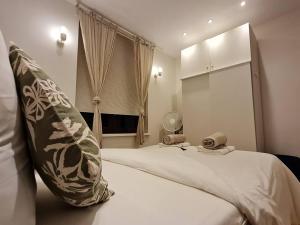 Postel nebo postele na pokoji v ubytování Studio chaleureux & moderne, région bruxelloise