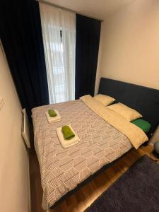 En eller flere senger på et rom på Apartman 34