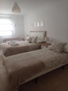 מיטה או מיטות בחדר ב-Casa rural Rocío - Caminito del Rey