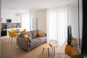 a living room with a couch and a table at Apartamentos Hartzenbusch in Teruel