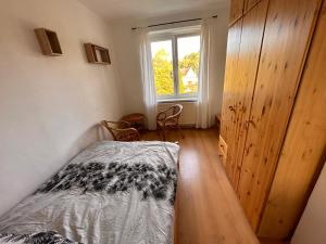Postel nebo postele na pokoji v ubytování Apartmán U náměstí Horní Blatná