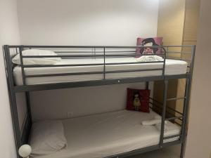 two bunk beds in a small room with at Luxurious 6 bedroom villa In a great location in Chalkida +39 photos