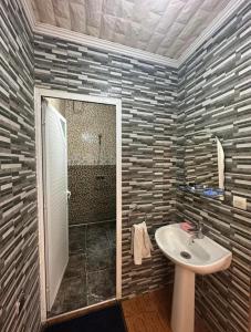 a bathroom with a sink and a shower at Hay mohammadi agadir in Agadir