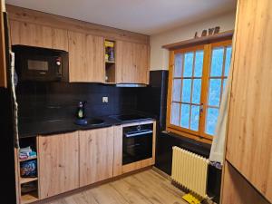 Η κουζίνα ή μικρή κουζίνα στο Le Panorama - Appartement 54 à Arolla face aux montagnes à 150m des pistes +34 φωτογραφίες