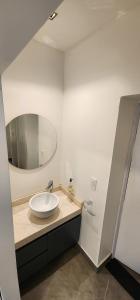 a bathroom with a sink and a mirror at 9 de julio in San Miguel de Tucumán