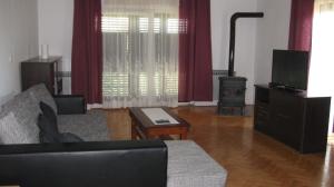 a living room with a couch and a television at Apartment Anita in Vodice