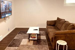 a living room with a couch and a coffee table at Afan Home of Joy in Winnipeg