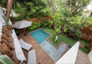 an overhead view of a swimming pool in a garden at New Villa 4BR private pool & jacuzzi TULUM Veleta in Tulum