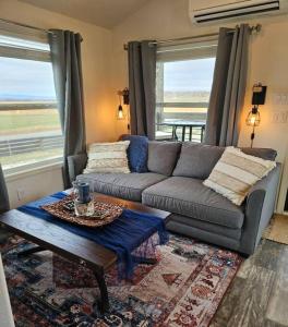 a living room with a couch and a coffee table at Buffalo Jump Guest House in Three Forks