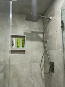 a bathroom with a shower with a glass door at Dayton Dream in Newark