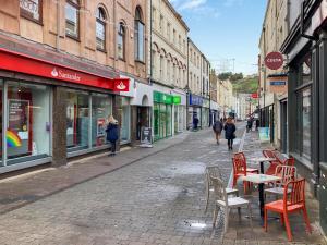 an empty street with chairs and tables in a city at Marina View in Whitehaven