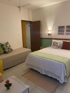 Postel nebo postele na pokoji v ubytování Villa Aconchego Guarajuba